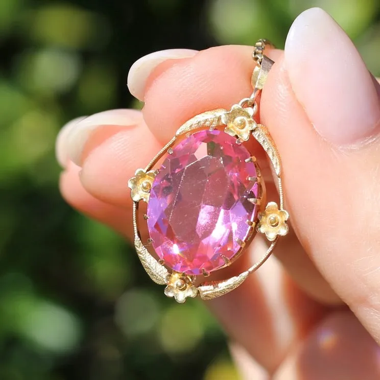 Circa 1930s-1950s Pink Paste Pendant in Decorative 9ct Gold Floral Surround, 4.23g